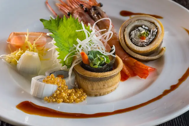 Chef’s plate of assorted small bites with sweet shrimp