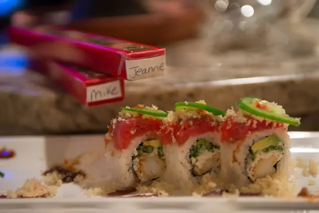 Tuna rolls topped with jalapeño slices at the sushi bar