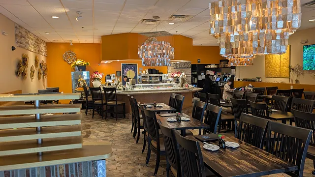 Interior of Sushi Niko Niko in Buford, Georgia with dining tables and sushi bar